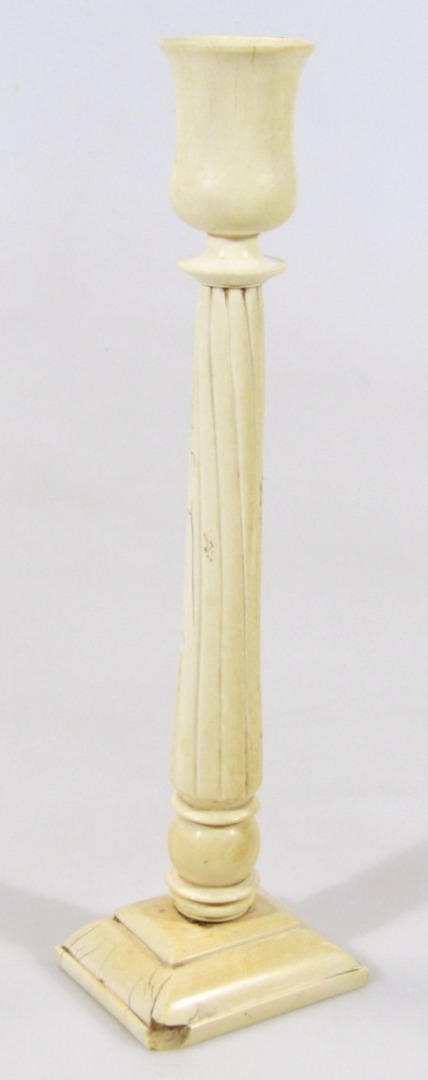 Appraisal: A late thC ivory candlestick with urn dish holder on