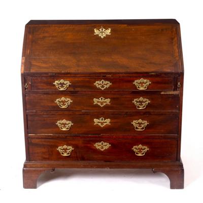 Appraisal: A George III mahogany bureau the fall enclosing a fitted