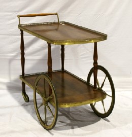 Appraisal: A brass mounted two tier tea trolley cm long cm