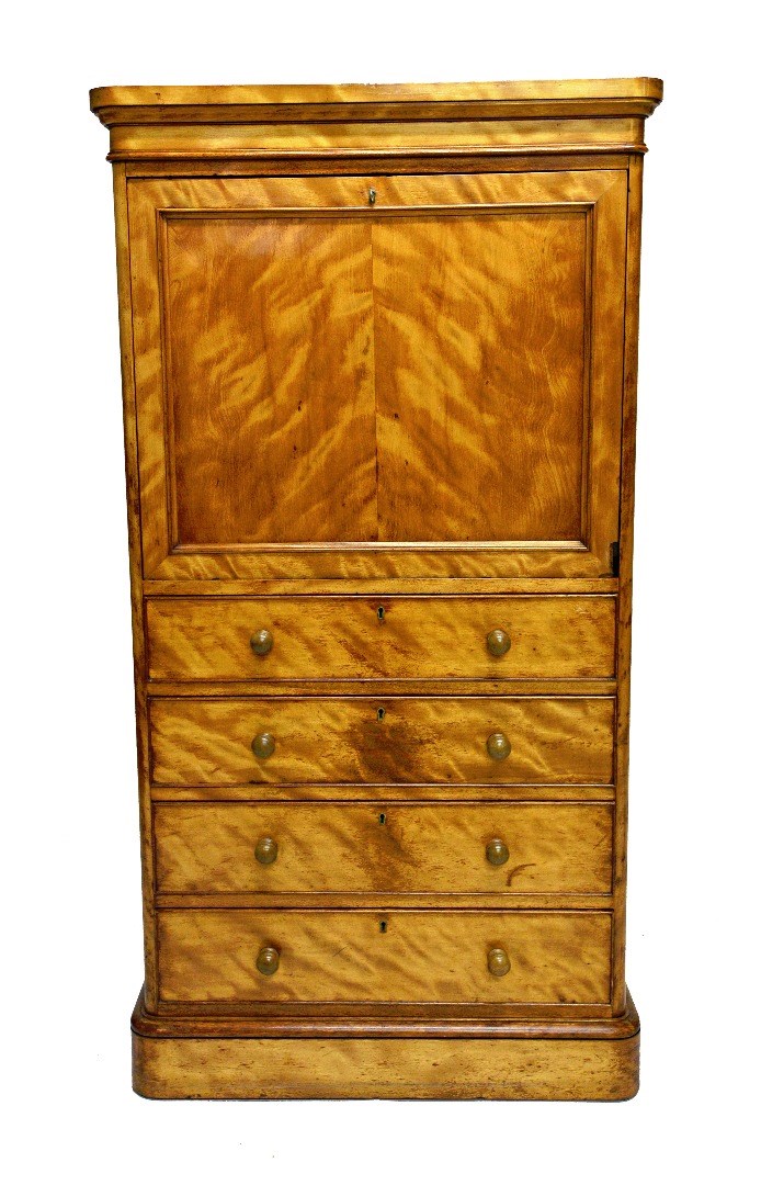 Appraisal: A Victorian satinwood secretaire Wellington chest the fitted interior over