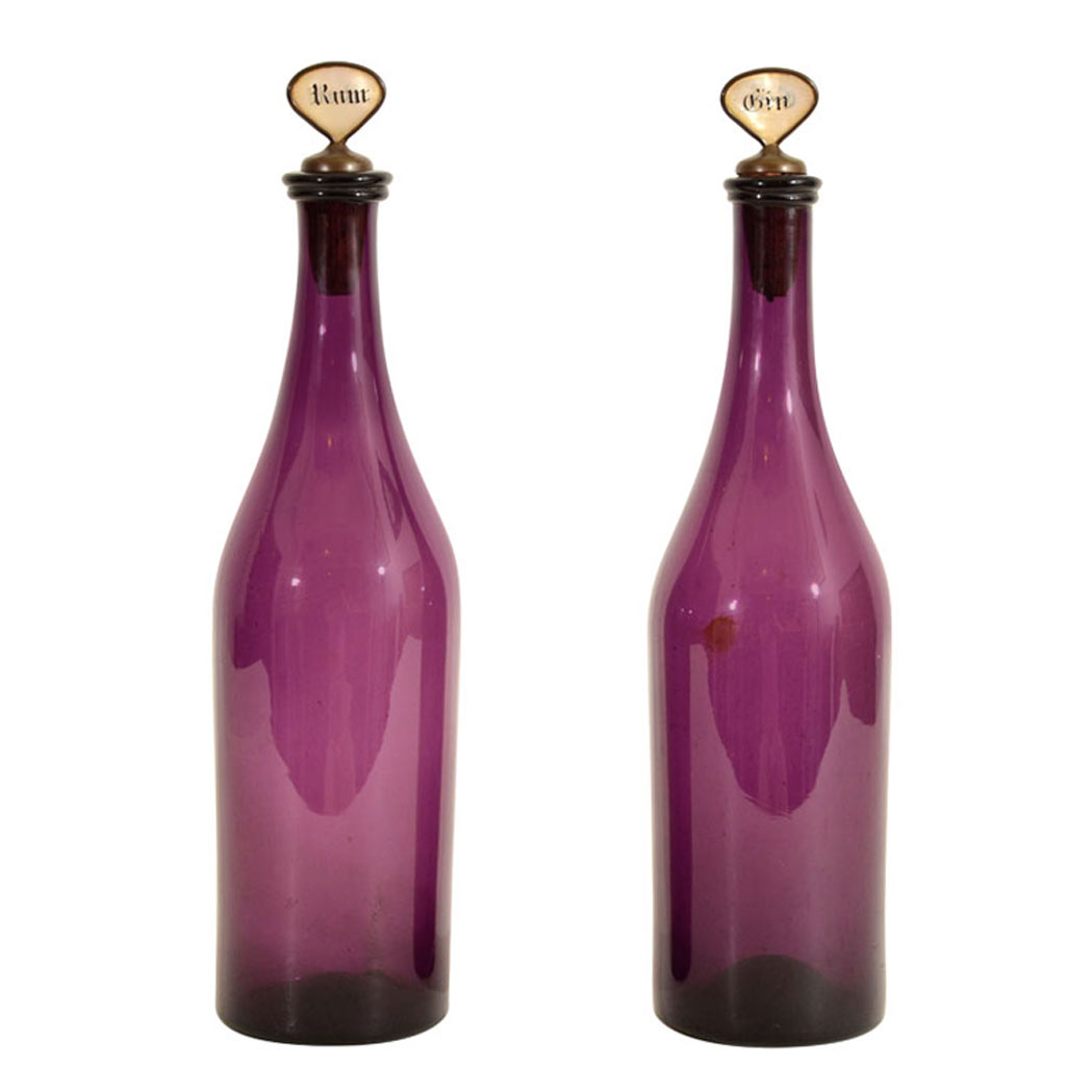 Appraisal: Pair of Amethyst Glass Decanters th Century Each with a