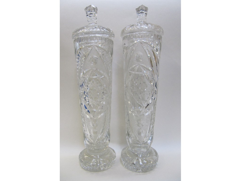 Appraisal: Pair of Bohemian crystal tall slender jars and covers with