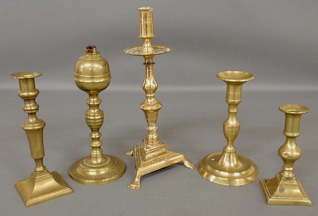 Appraisal: - Four th c Continental and English brass candlesticks tallest