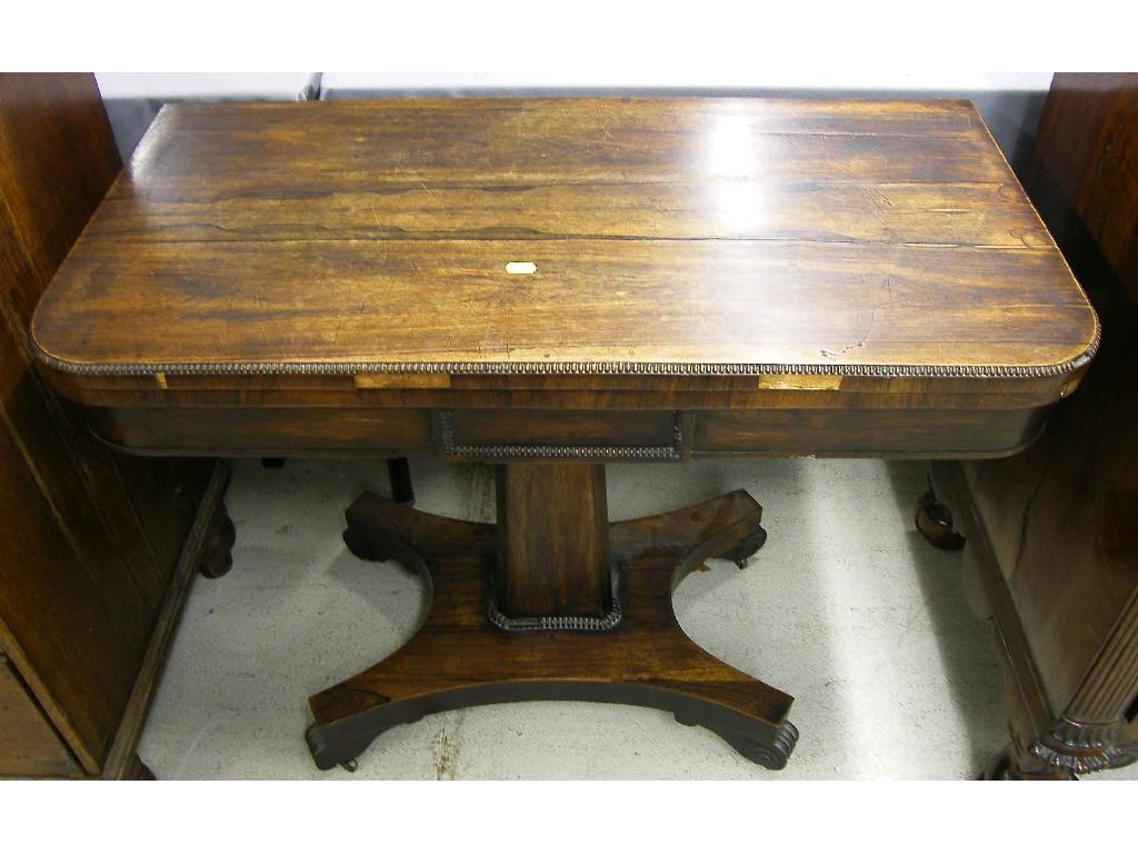 Appraisal: Regency rosewood fold-over pedestal card table the beaded top supported