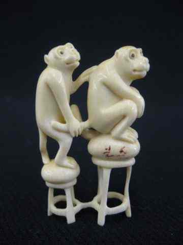 Appraisal: Carved Ivory Netsuke two monkies on stools onyx eyes ''