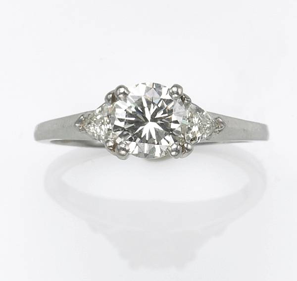 Appraisal: A diamond and platinum ring center diamond weighing an estimated