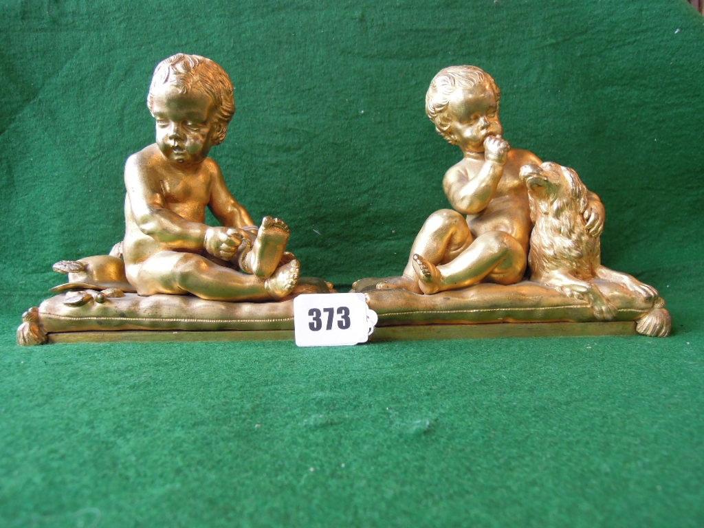 Appraisal: Two gilt ormolu figures of a young Mercury seated on