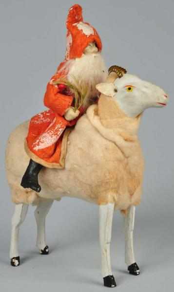 Appraisal: Santa Riding Cotton-Covered Ram with Brass Horns Description Well-painted and