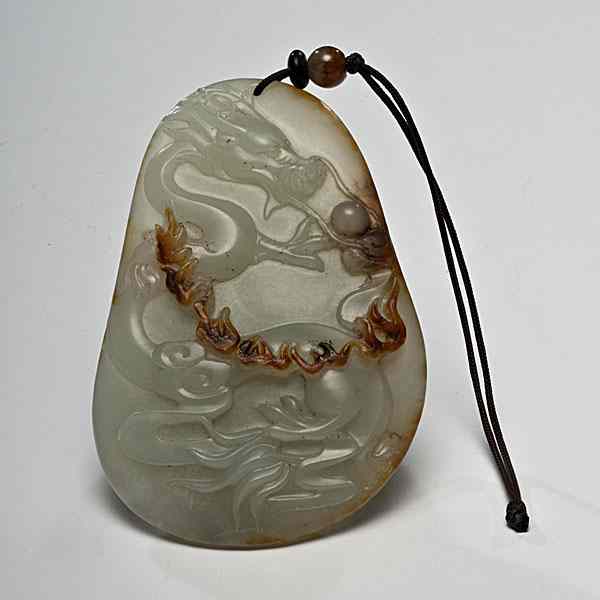 Appraisal: Chinese Carved Jade Dragon Pendant Chinese a carved dragon pendant