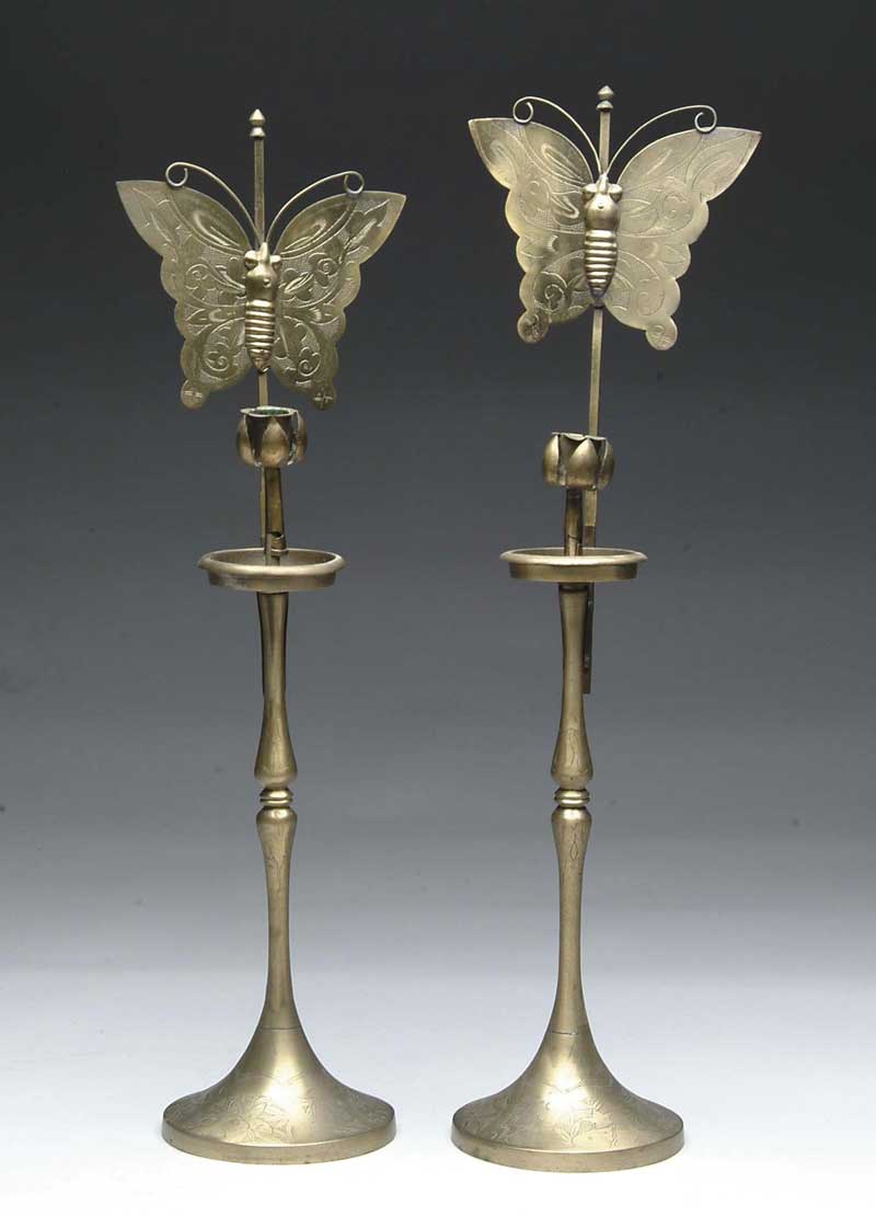 Appraisal: PAIR OF BRASS CANDLESTICKS WITH BUTTERFLY REFLECTORS Etched flower design