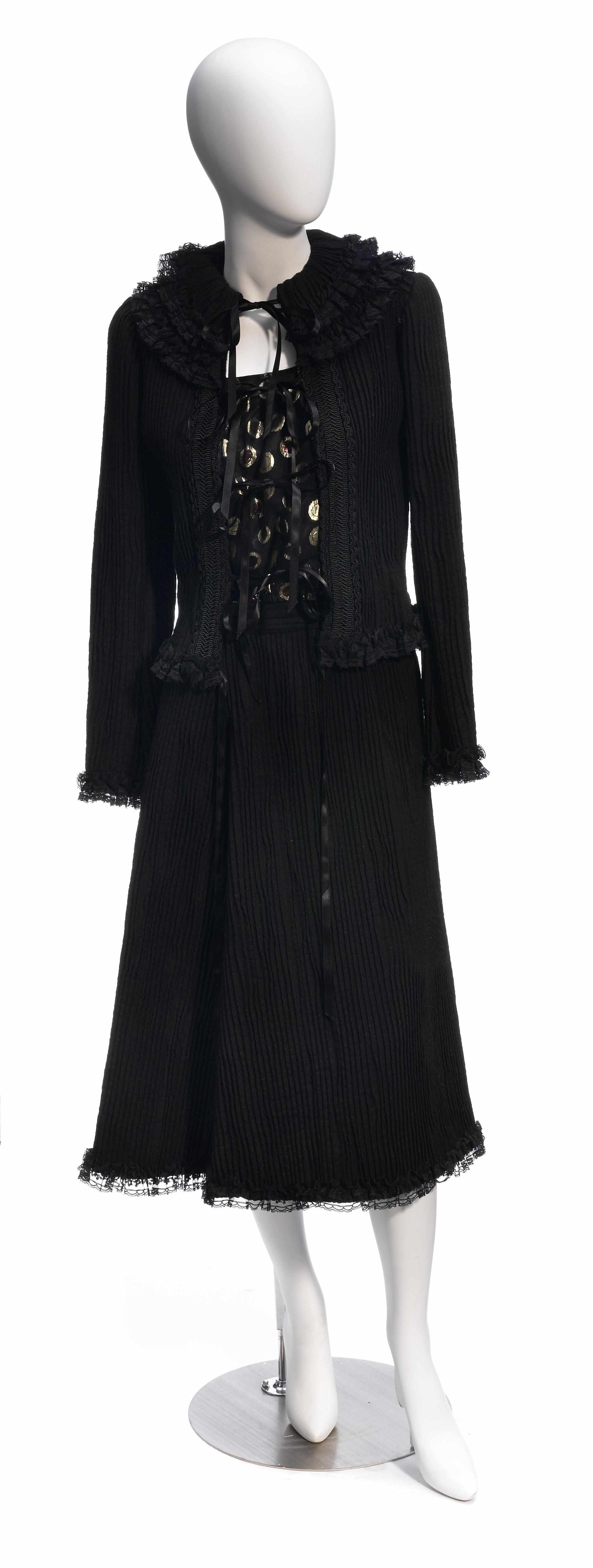 Appraisal: A Koos black worsted and pleated wool and lace ruffle