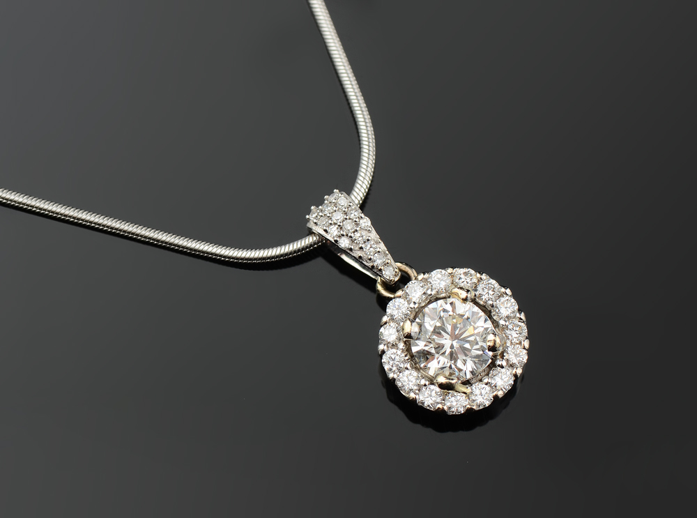 Appraisal: DIAMOND HALO PENDANT NECKLACE K white gold necklace the pendant