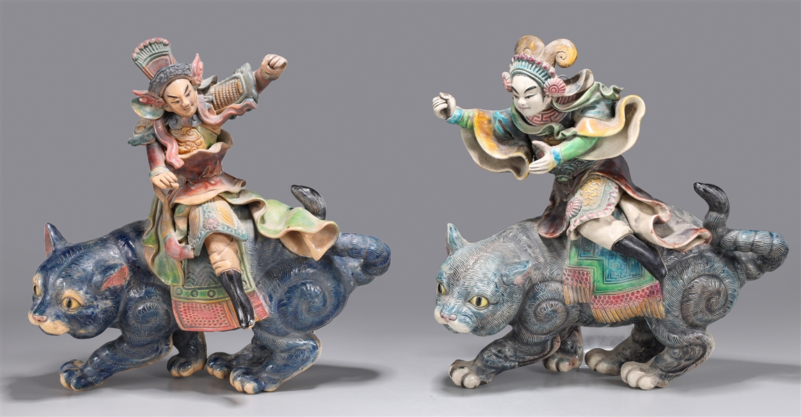 Appraisal: Pair of elaborate glazed Chinese roof tiles depicting figures atop