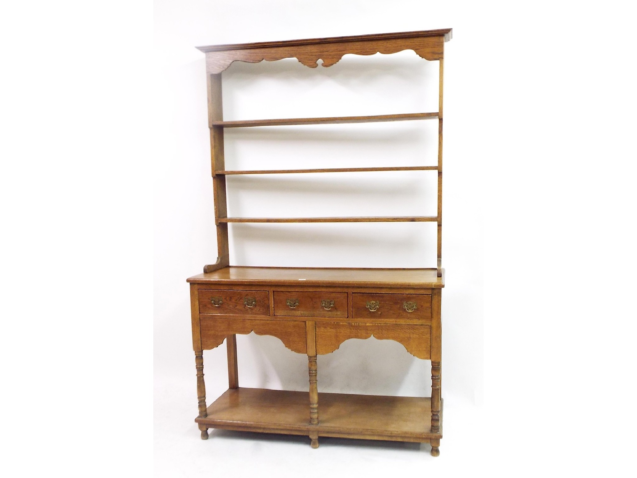 Appraisal: Georgian style golden oak Welsh dresser with raised Delft rack