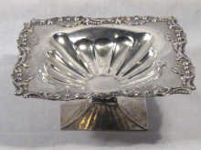 Appraisal: A Latvian silver square dish on a square pedestal foot