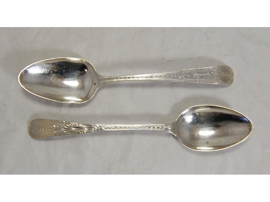 Appraisal: Two Georgian bright cut silver tablespoons one bottom marked Exeter