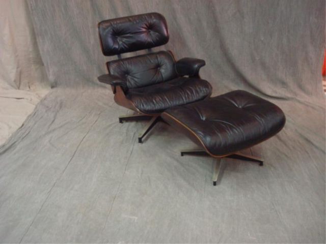 Appraisal: Eames Midcentury black leather chair ottoman Has black leather and