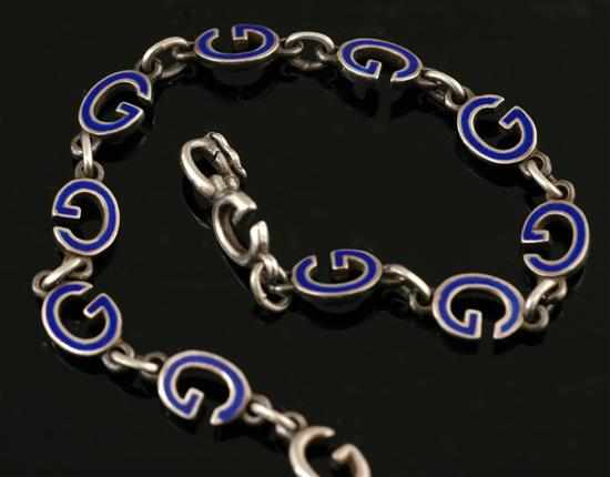 Appraisal: A silver and enamel bracelet by Gucci Comprising 'G' links