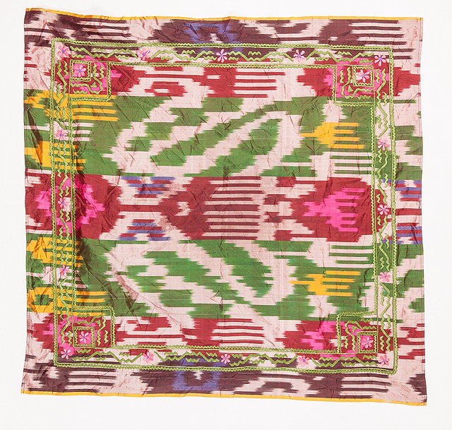 Appraisal: AN IKAT SQUARE HEAD SCARF with polychrome stylised and flower