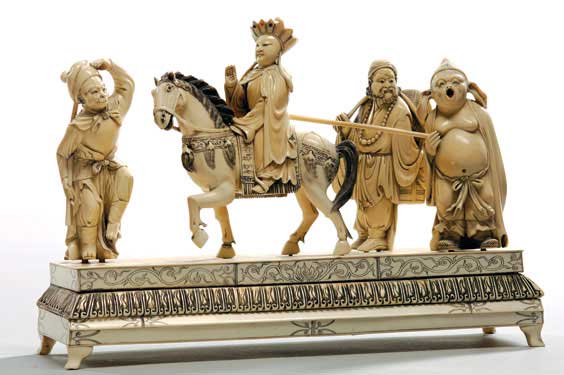 Appraisal: CHINESE CARVED IVORY GROUP Chinese carved ivory group of an