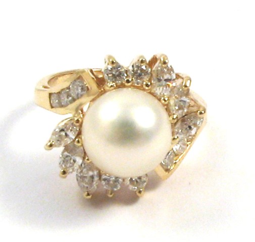 Appraisal: PEARL AND FOURTEEN KARAT GOLD RING centering an mm round