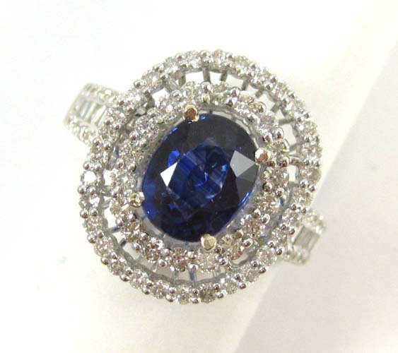 Appraisal: SAPPHIRE DIAMOND AND FOURTEEN KARAT WHITE GOLD RING with round-cut