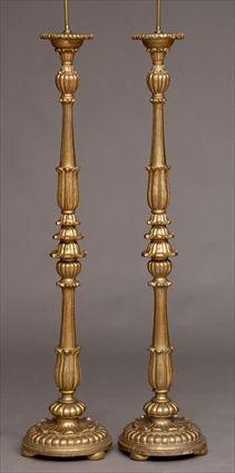 Appraisal: PAIR OF BAROQUE-STYLE CARVED GILTWOOD TORCHERES MOUNTED AS LAMPS Each