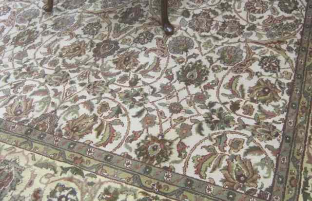 Appraisal: HAND KNOTTED ORIENTAL CARPET Indo-Persian overall floral decoration on cream