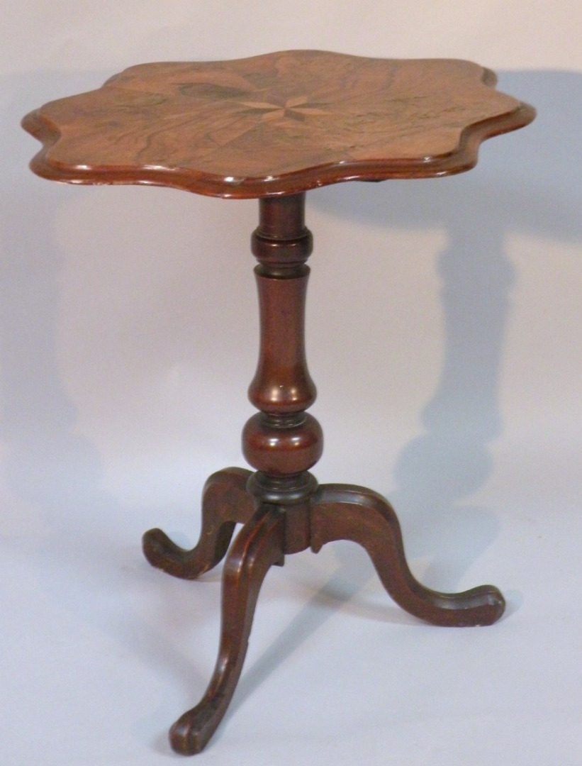 Appraisal: A late thC walnut occasional table the shaped top centred