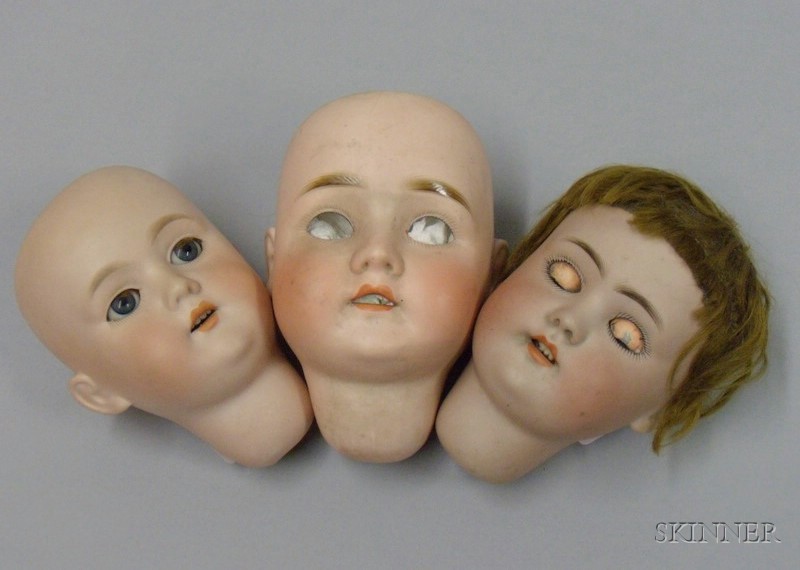 Appraisal: Bisque Head Doll and Two Bisque Doll Heads Germany early