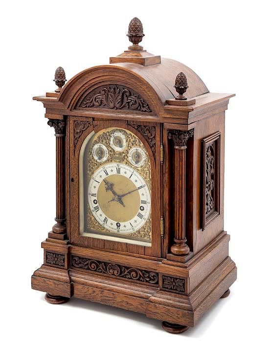 Appraisal: A Black Forest Oak Bracket Clock Height x width x