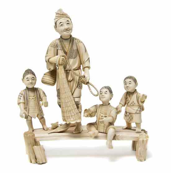 Appraisal: A Japanese Carved Ivory Figural Group depicting a gentleman amongst