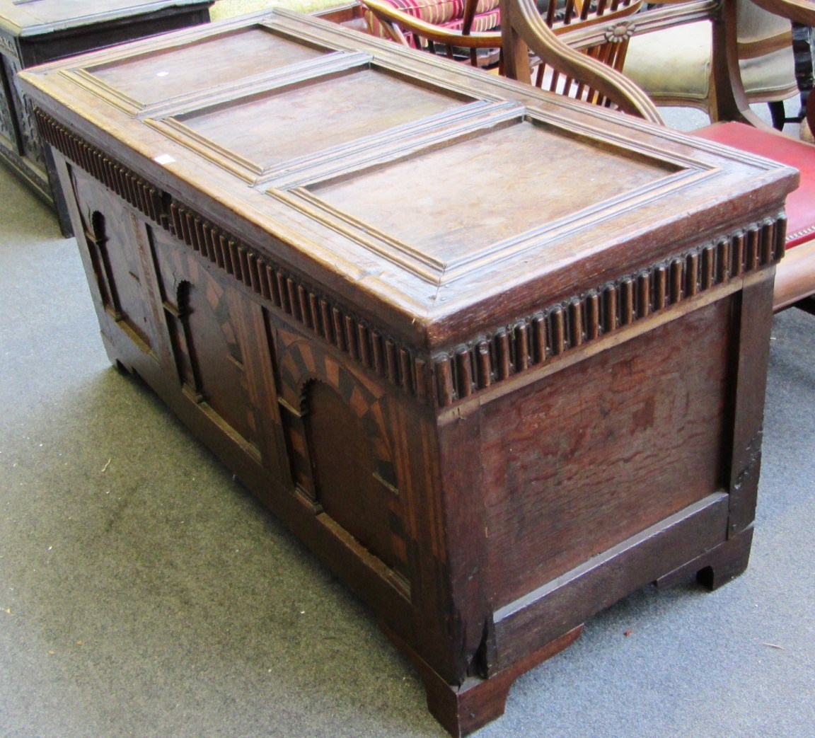 Appraisal: A James I oak coffer the triple panel top over