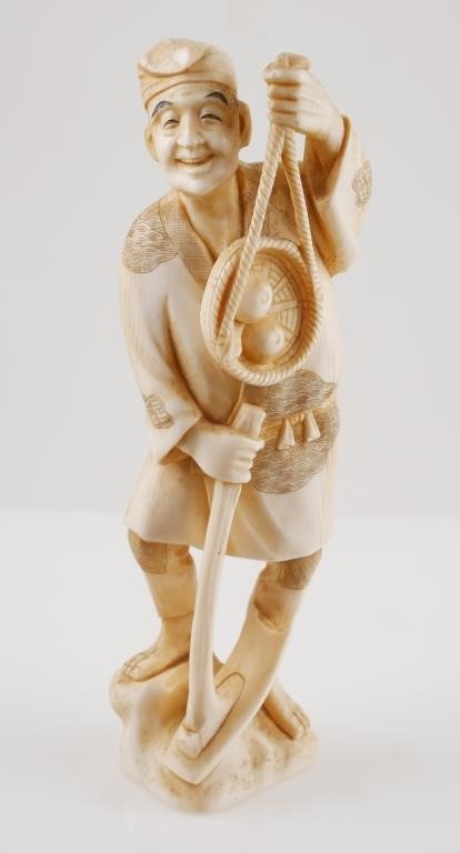 Appraisal: Antique Japanese carved ivory farmer with hoe and basket sculpture