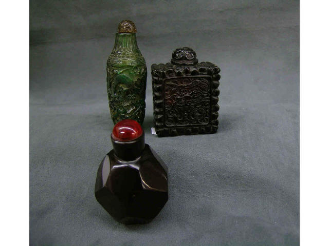 Appraisal: Three antique oriental snuff bottles including one faceted ruby bottle