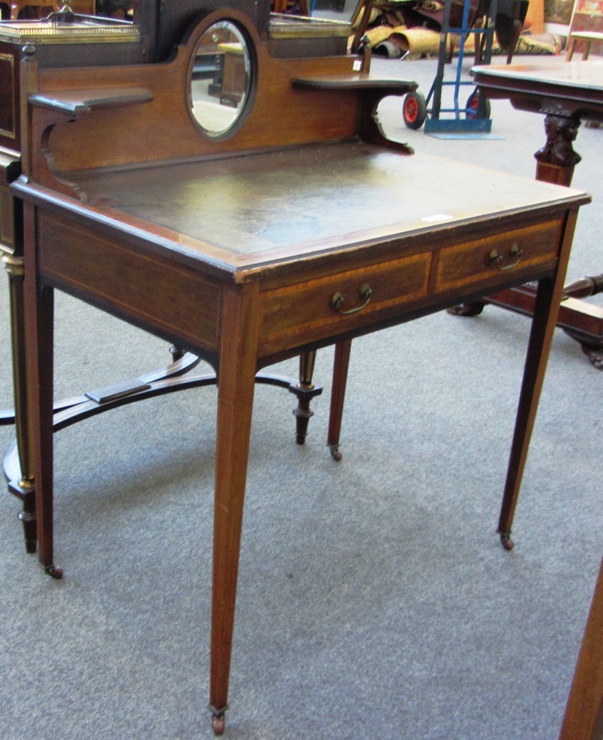 Appraisal: An Edwardian mahogany satinwood banded writing desk with leather inset