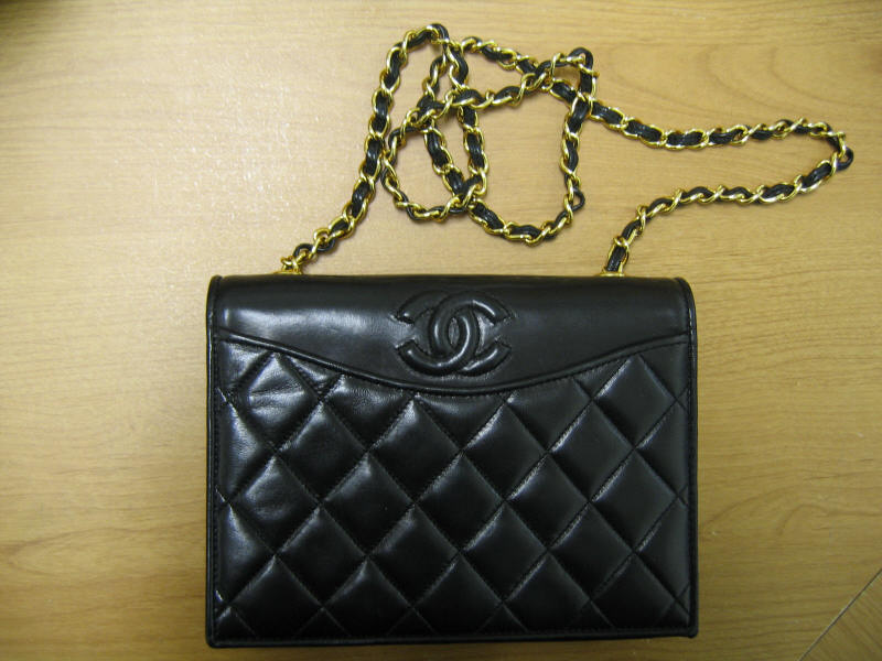 Appraisal: CHANEL HANDBAG Black quilted lambskin vintage handbag with signature CC