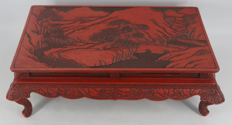 Appraisal: CINNABAR LACQUERED KANG TABLE Displaying a landscape scene of figures