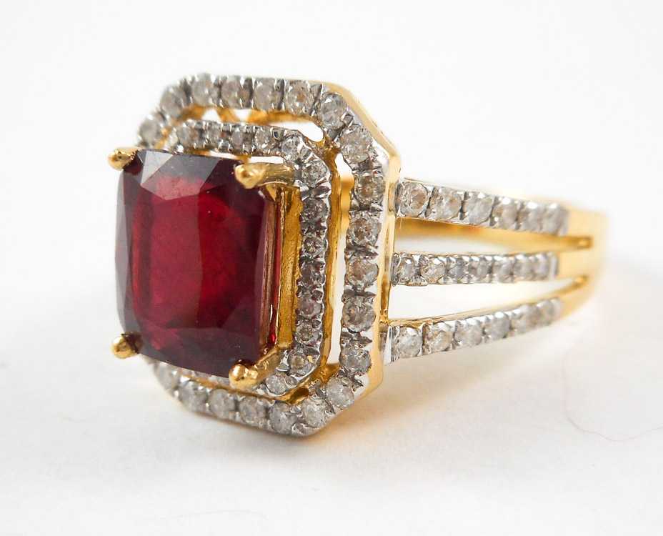 Appraisal: RUBY DIAMOND AND FOURTEEN KARAT GOLD RING with round-cut diamonds