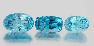 Appraisal: A Group of Three Mixed Cut Blue Topaz Carat Containing