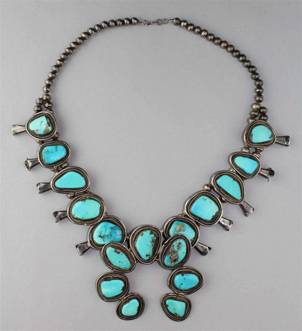 Appraisal: NATIVE AMERICAN SILVER AND TURQUOISE SQUASH BLOSSOM NECKLACE the squash