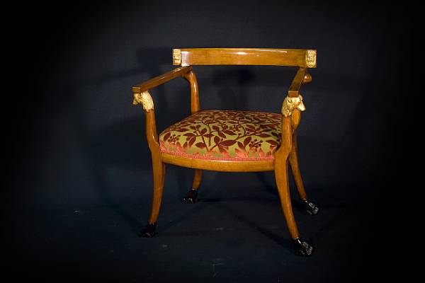 Appraisal: A pair of Italian Neoclassical style fruitwood and parcel gilt