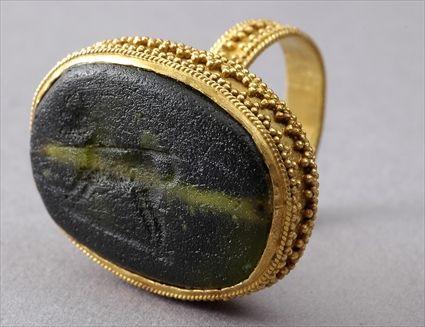 Appraisal: Persian Glass Gem Set in a Granulated Gold Ring