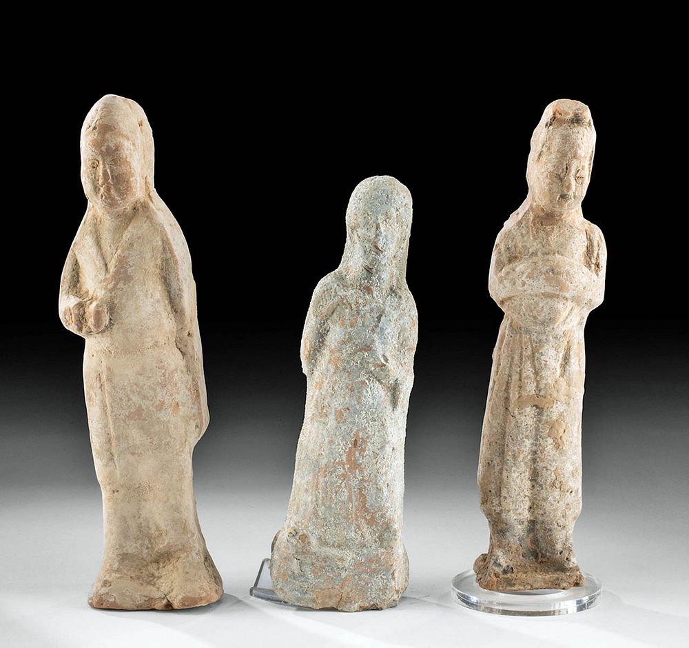 Appraisal: Chinese Han Pottery Female Tomb Attendants Originally Listed At East