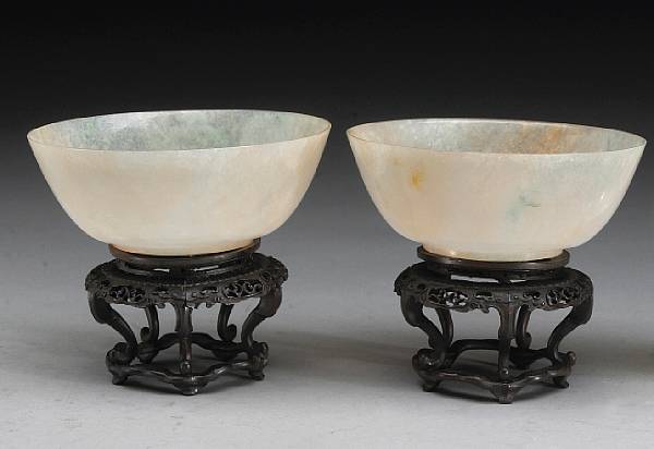 Appraisal: A pair of translucent jadeite bowls Their thinly cut walls