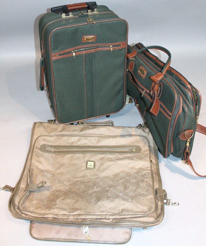 Appraisal: A Harrods green velvet suitcase with brown trim cm high