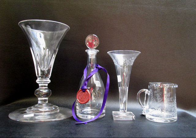 Appraisal: FOUR WILLIAM HOWARD CRYSTAL TABLEWARE PIECES vases liqueur decanter and