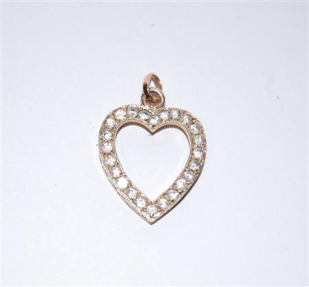 Appraisal: A diamond mounted heart shaped pendant the gold mounted with