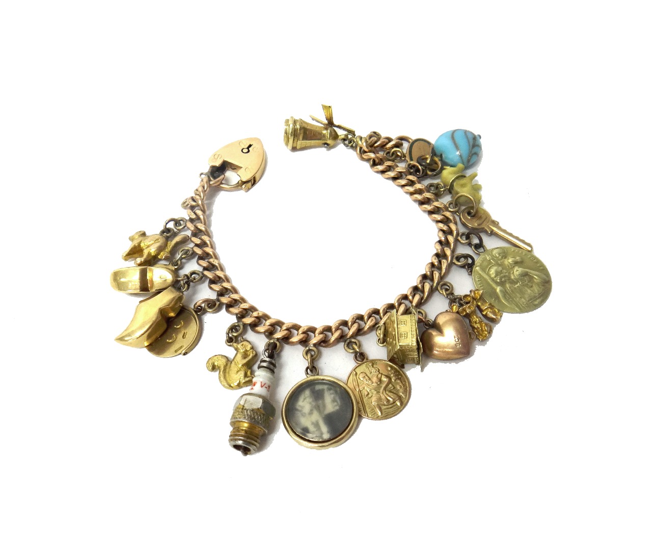 Appraisal: A ct gold curb link charm bracelet with a gold