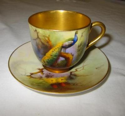 Appraisal: A ROYAL WORCESTER PORCELAIN CABINET CUP AND SAUCER painted with